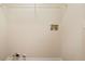 Laundry closet with shelving and hookups for washer/dryer at 4245 Sterling Pointe Dr, Douglasville, GA 30135