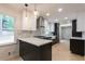 Updated kitchen featuring marble backsplash and modern fixtures at 4827 Springfield Dr, Atlanta, GA 30338