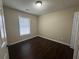 Simple bedroom with dark brown wood-look flooring at 855 Scenic Lake Dr, Lawrenceville, GA 30045