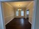 Bright dining room with dark hardwood floors and chandelier at 855 Scenic Lake Dr, Lawrenceville, GA 30045