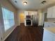 Kitchen with white cabinets, stainless steel appliances, and dark floors at 855 Scenic Lake Dr, Lawrenceville, GA 30045