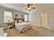 Spacious bedroom with neutral decor and ceiling fan at 3006 Cambridge Hill Dr, Dacula, GA 30019