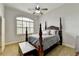 Charming bedroom with a four-poster bed and hardwood floors at 3006 Cambridge Hill Dr, Dacula, GA 30019