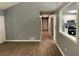 Gray hallway with wood-look floors and doors leading to other rooms at 6506 S Gordon Rd, Austell, GA 30168