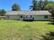 Back of house showing a deck and spacious yard at 6506 S Gordon Rd, Austell, GA 30168