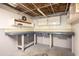 Basement workshop with workbench and storage shelving at 2995 Clearwater Dr, Douglasville, GA 30135