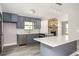 Modern kitchen with gray cabinets and a large island at 2995 Clearwater Dr, Douglasville, GA 30135