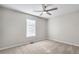 Bedroom with ceiling fan and large window at 3968 Rainover Dr, Decatur, GA 30034