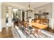 Formal dining room with hardwood floors, chandelier, and large windows at 230 Edwards Brook Ct, Canton, GA 30115