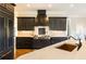 Modern kitchen with dark cabinets and copper sink at 230 Edwards Brook Ct, Canton, GA 30115