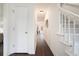 Bright entryway with hardwood floors, white doors, and staircase at 7011 Overlook Pt, Stone Mountain, GA 30087