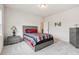 Bedroom with gray dresser and red, white, and blue bedding at 755 Henson Farm Dr, Loganville, GA 30052