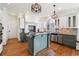 Two-toned kitchen with granite countertops, island, and stainless steel appliances at 4159 Gemstone Ter, Marietta, GA 30062