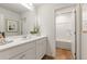 Clean bathroom with a tub, shower, and white vanity at 5563 Rosehall Pl, Atlanta, GA 30349