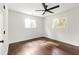 Bright bedroom with hardwood floors and ceiling fan at 1567 Paxon Se St, Atlanta, GA 30317