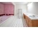 Bathroom with a large vanity and a whirlpool tub at 70 E Honeysuckle Ln, Carrollton, GA 30116