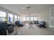 Sunroom features a wet bar, comfortable seating and plenty of natural light at 70 E Honeysuckle Ln, Carrollton, GA 30116