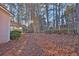 Backyard with screened porch and mature shrubs at 1035 Bridle Path Dr, Lawrenceville, GA 30045