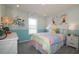 Charming bedroom with rainbow bedding and bike decor at 146 Oakchase Park Ln, Hampton, GA 30228