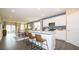 Open concept kitchen features island and breakfast bar at 146 Oakchase Park Ln, Hampton, GA 30228