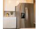Stainless steel refrigerator in a white kitchen at 146 Oakchase Park Ln, Hampton, GA 30228