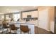 Open concept kitchen with island and breakfast bar at 146 Oakchase Park Ln, Hampton, GA 30228