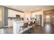 White kitchen cabinets, stainless steel appliances, and island at 146 Oakchase Park Ln, Hampton, GA 30228