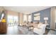 Spacious living room with hardwood floors and patio access at 146 Oakchase Park Ln, Hampton, GA 30228