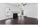 Living room with fireplace, hardwood floors, and large windows at 301 Ashbourne Trl, Lawrenceville, GA 30043