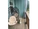 Relaxing porch with hanging egg chairs and a side table at 732 Fond Ln, Atlanta, GA 30315