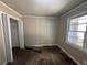 Spacious bedroom with wood floors and closet at 2028 Wells Sw Dr, Atlanta, GA 30311