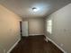 Hardwood floor bedroom with window and door at 2028 Wells Sw Dr, Atlanta, GA 30311