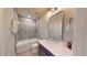 Modern bathroom with a glass shower, soaking tub, and dark vanity at 324 Concord St, Alpharetta, GA 30009