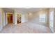 Bright bedroom featuring carpet, plantation shutters, and an ensuite bathroom at 324 Concord St, Alpharetta, GA 30009