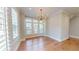 Bright dining room with hardwood floors and a modern light fixture at 324 Concord St, Alpharetta, GA 30009