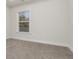 Simple bedroom with carpet flooring and a large window at 2065 Morrison Ave, Brookhaven, GA 30319