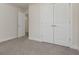 Bright bedroom with double doors leading to a bathroom at 2065 Morrison Ave, Brookhaven, GA 30319