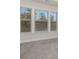 Spacious bedroom with neutral decor, featuring three large windows at 2065 Morrison Ave, Brookhaven, GA 30319