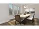 Bright dining room featuring large windows and hardwood floors at 2065 Morrison Ave, Brookhaven, GA 30319