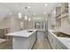 Modern kitchen with gray cabinets, quartz countertops and stainless steel appliances at 2065 Morrison Ave, Brookhaven, GA 30319