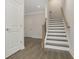 Elegant staircase with dark wood accents and white risers at 2065 Morrison Ave, Brookhaven, GA 30319
