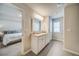 Double vanity bathroom with granite countertop at 717 Woodstock Grove Dr, Woodstock, GA 30188