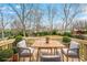 Relaxing deck with wooden furniture, offering a view of the backyard at 1122 Dobbs Se Dr, Atlanta, GA 30316