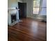 Hardwood floors and a fireplace in a living room at 1786 Lakewood Ave, Atlanta, GA 30315