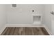 Laundry room with vinyl flooring and built-in shelving at 205 Oak View Ln, Dallas, GA 30157