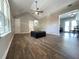 Living room with hardwood floors and vaulted ceiling at 28 Fawn Ct, Sharpsburg, GA 30277