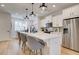 Modern kitchen with white cabinets, quartz countertops, and stainless steel appliances at 1923 Cassia Aly, Kennesaw, GA 30144