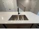 Modern kitchen sink and faucet with white quartz countertop at 1923 Cassia Aly, Kennesaw, GA 30144