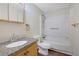 Bathroom with granite vanity, shower/tub combo, and a mirrored cabinet at 3267 Sunderland Dr, Snellville, GA 30039