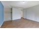 Bright bedroom featuring wood floors and built-in shelving at 3267 Sunderland Dr, Snellville, GA 30039